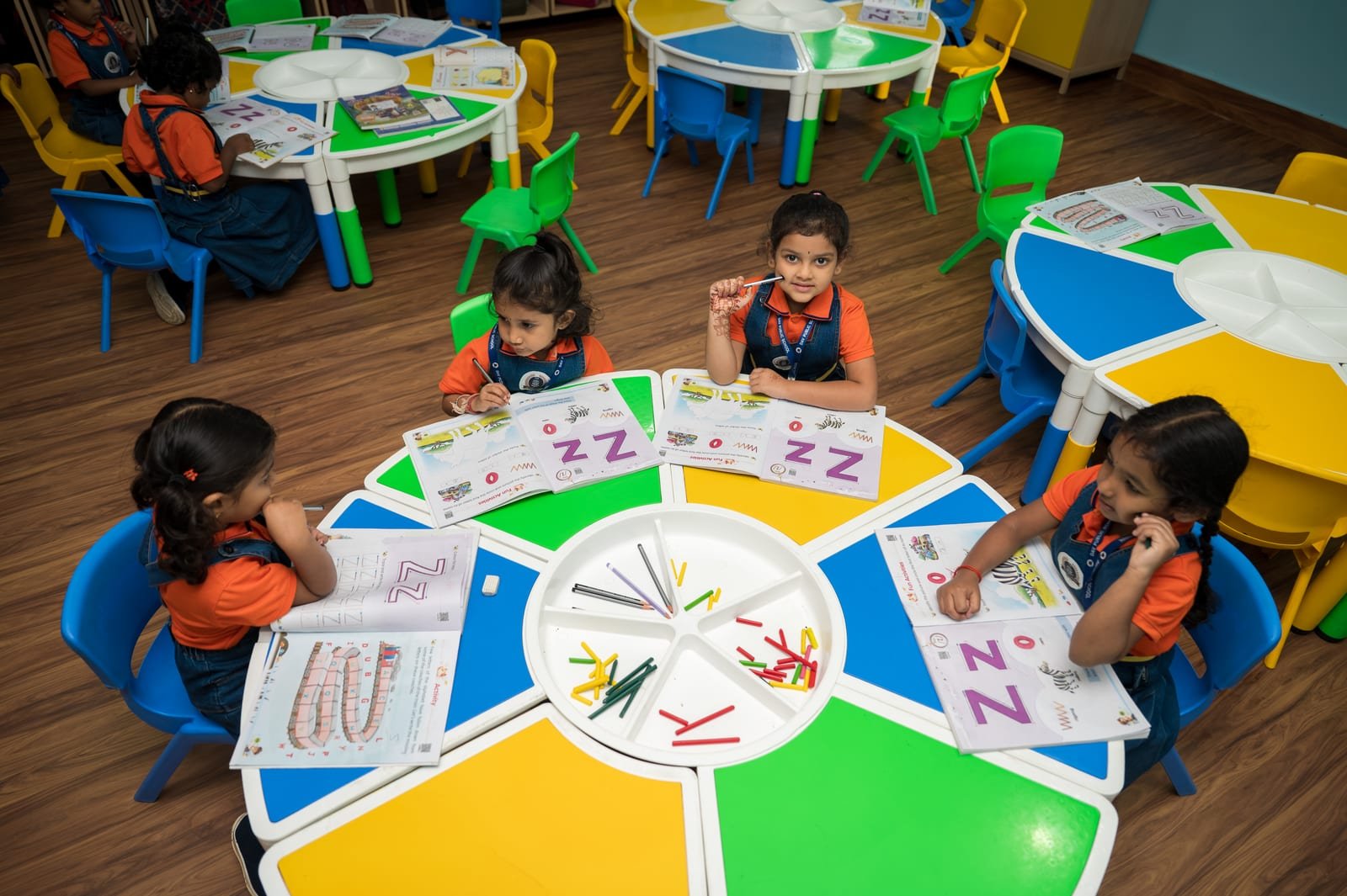Young DAV students at a classroom activity table